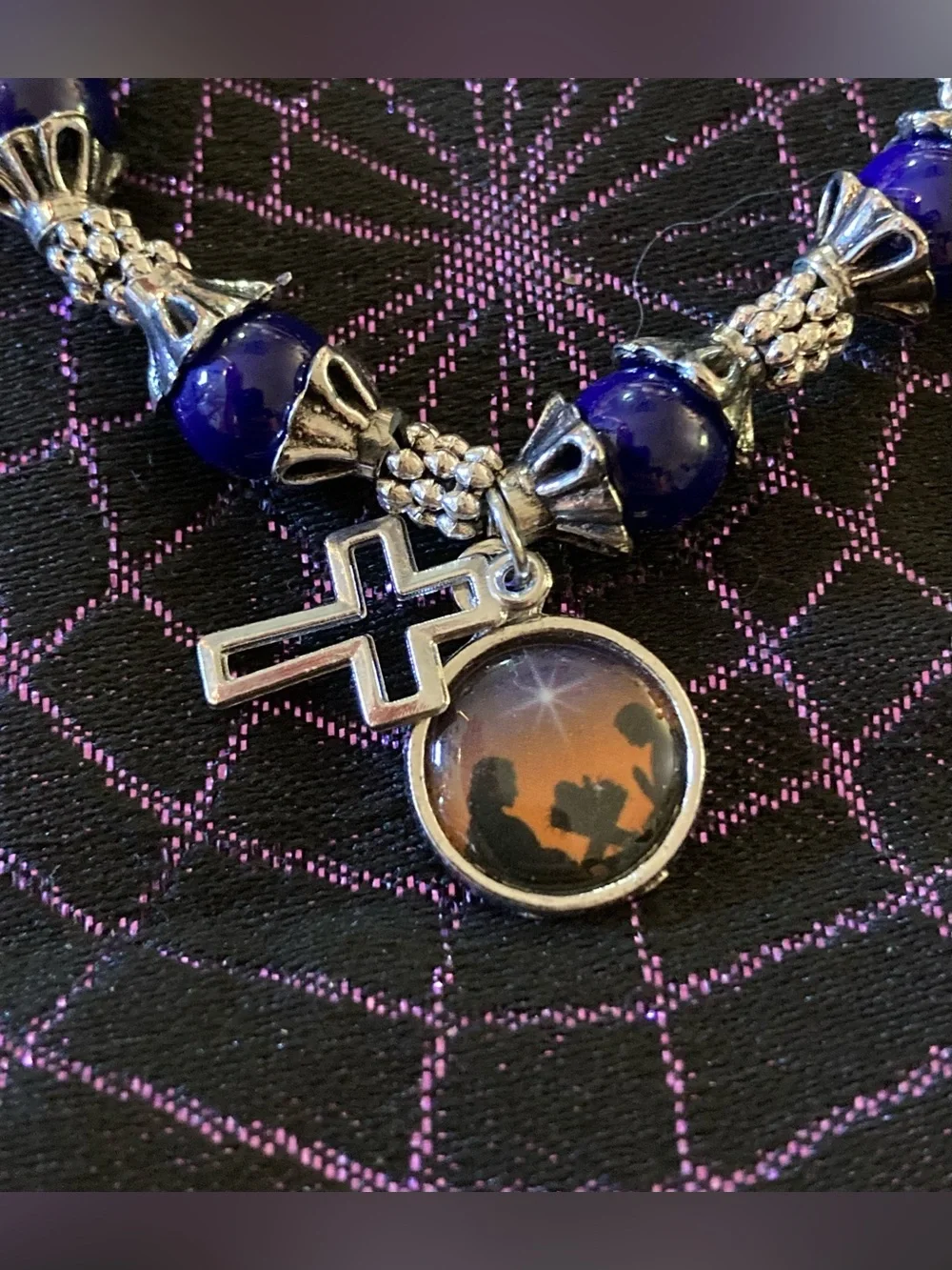 Blue and Silver Tone Bracelet with Baby Jesus, Mary, Joseph, and Cross Charm.